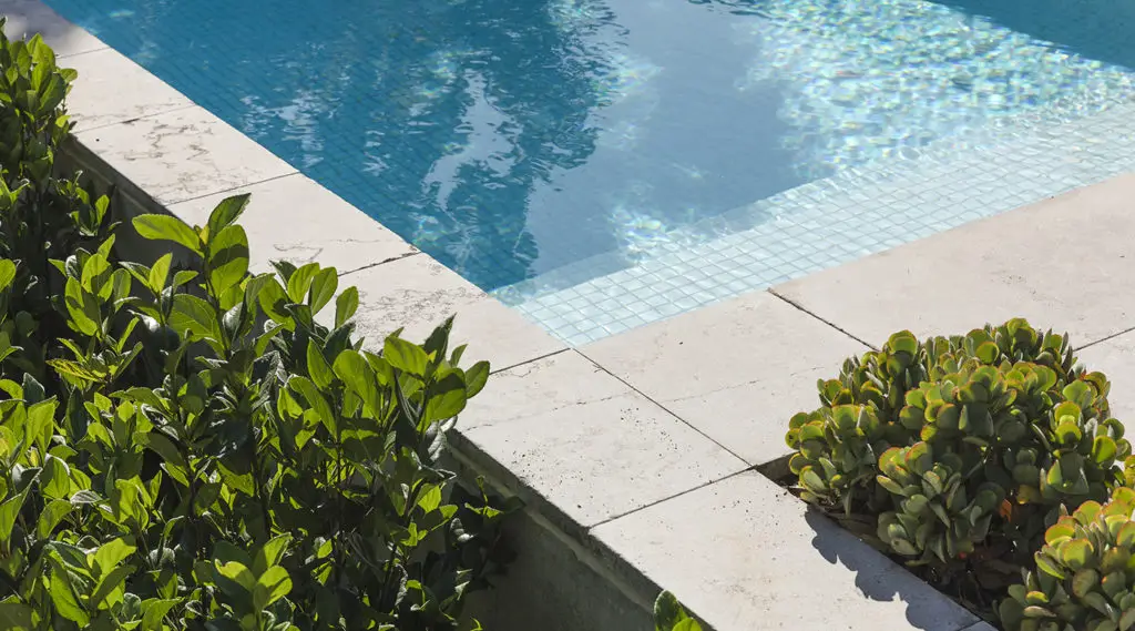 glistening tiles in a concrete pool