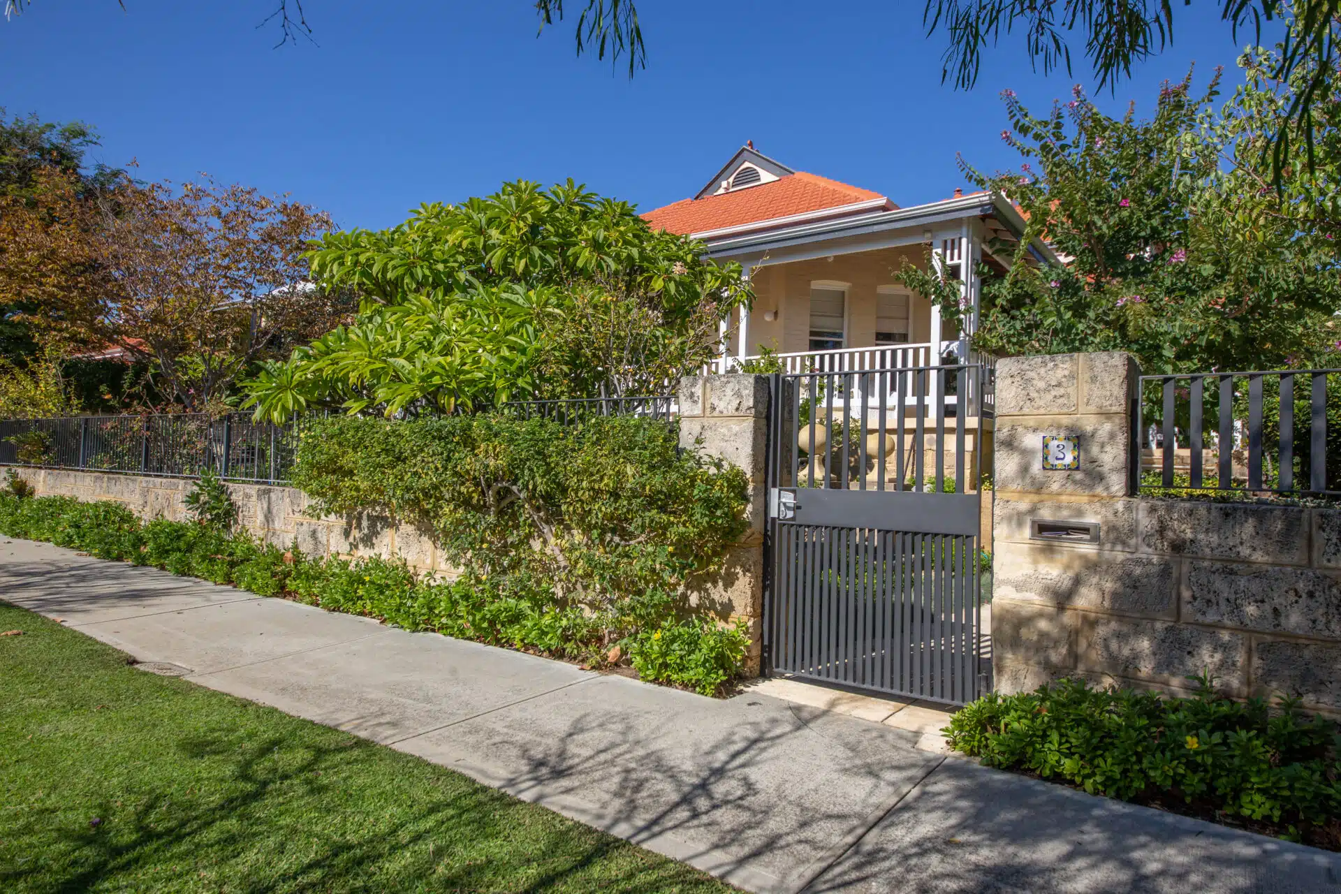 Front yard with limestone fence