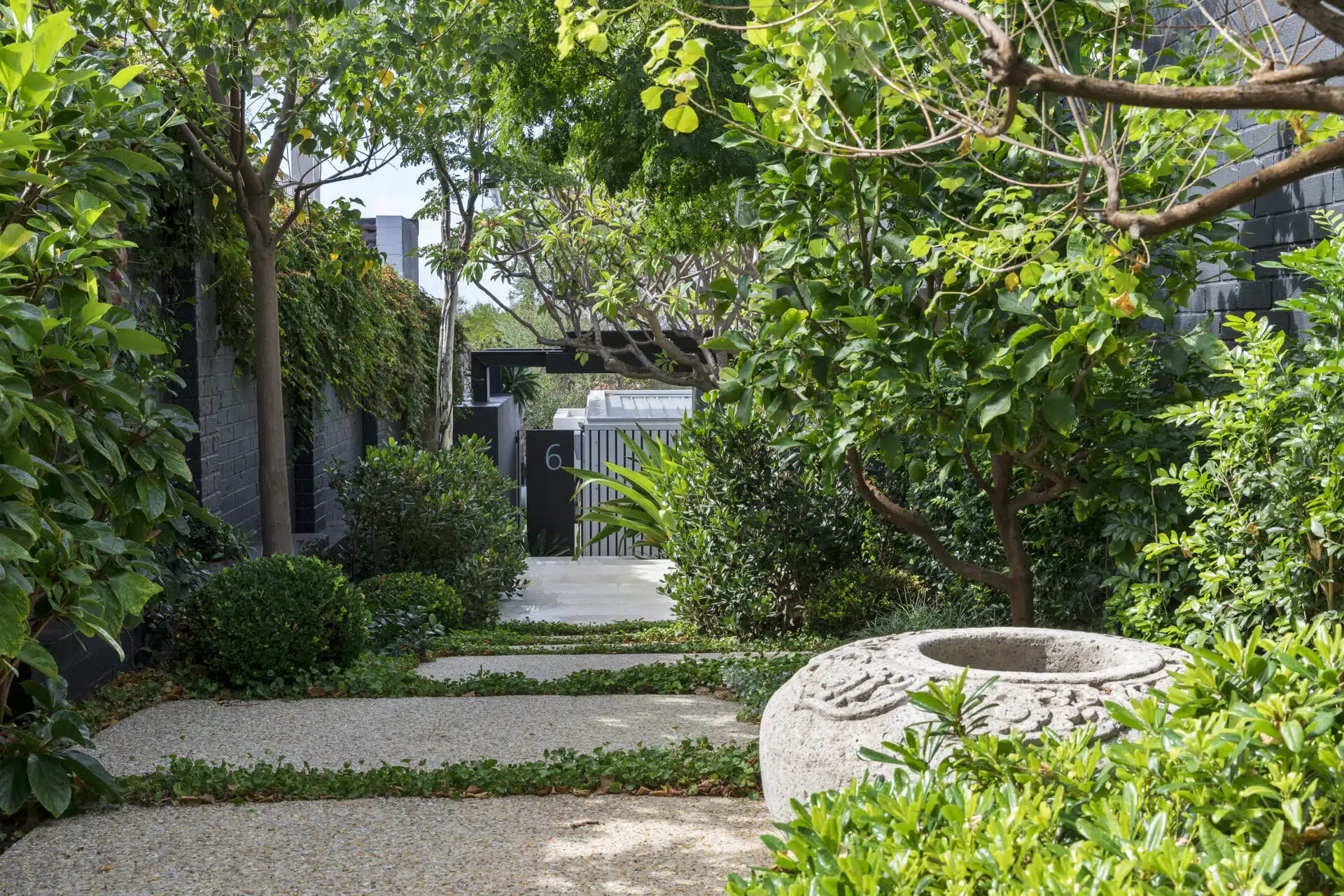 Entry way framed with greenery